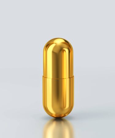 Golden capsule pill isolated on gray background. 3D rendering with clipping pathの写真素材