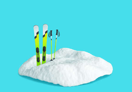 Skis in snow isolated on blue background. Winter season and skiing concept. 3D renderingの写真素材