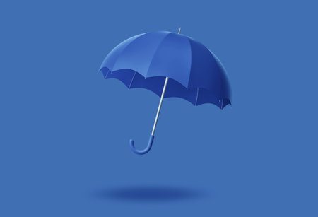 Green umbrella isolated on solid blue background. 3D renderingの写真素材
