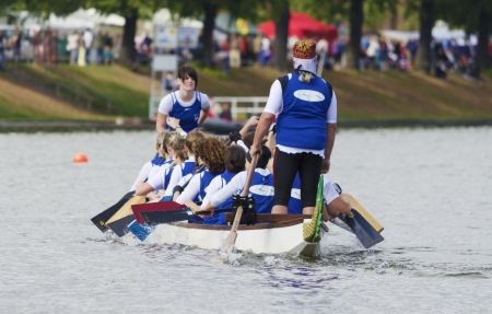 A group of female athletes on their boat at the anual dragon boat festival on the Pfaffenteich in...