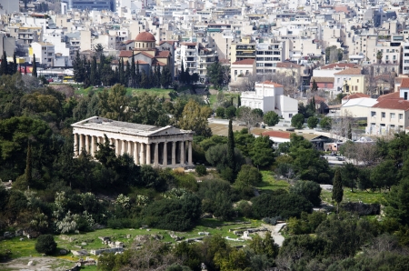 The Temple of Hephaestus is the best conserved ancient Greek temple in Athens  It forms a striking contrast to the modern city の写真素材