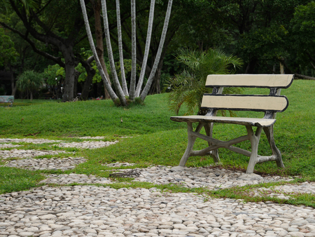 Wooden park bench at the park in Thailandの写真素材