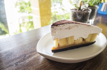 Banoffee pie / cake on white dish in the coffee shopの写真素材