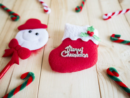 One Christmas sock and decoration on wood background (Merry Christmas Holiday)の写真素材