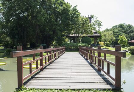 Wooden bridge in the park under sunlight in the afternoonの写真素材