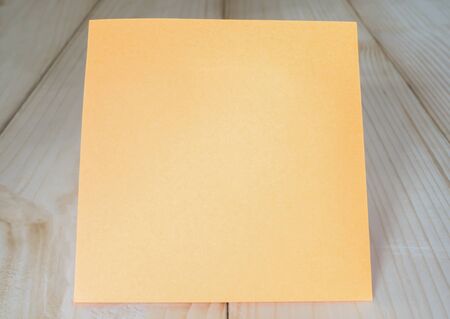 Colorful sticky note and paper clip on wood backgroundの写真素材