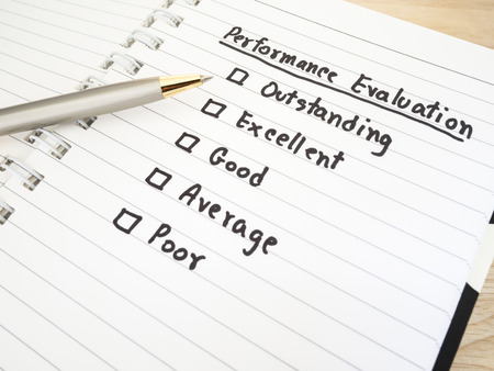 Performance Evaluation check box on white notebook (Business concept)の写真素材