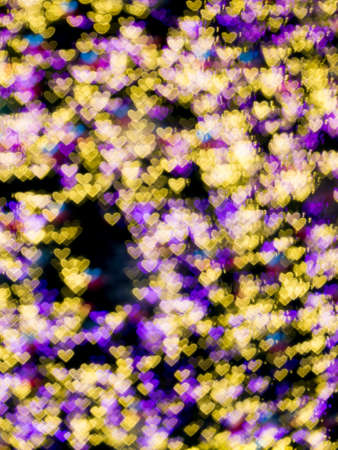 Heart shape colorful bokeh background from the light at the night
