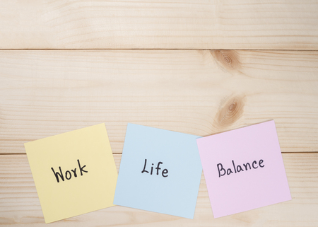 Word "Work Life Balance" on colorful note paper with wood backgroundの写真素材