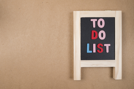To do list on blackboard on brown paper background (Business Concept)の写真素材