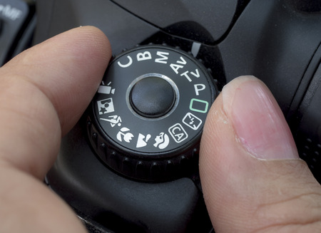 Close up woman finger roll the digital camera button (Selective focus)の写真素材