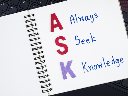 Word spell ASK and handwriting word Always Seek Knowledge on notebook with laptop keyboard