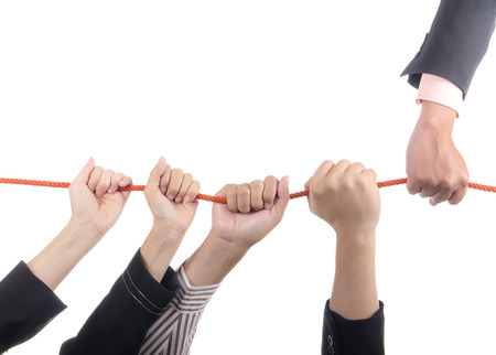 Business people hold rope on isolated / white background with leader conceptの写真素材
