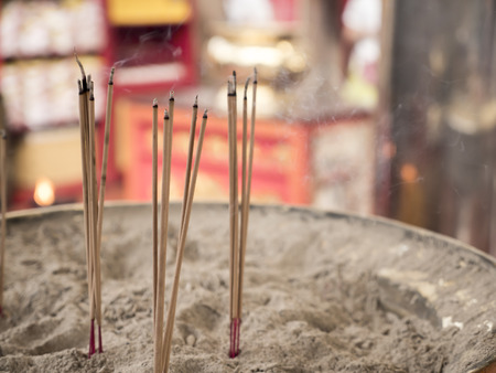 Incense sticks in the incense burner at the temple in Thailand (Selective focus)の写真素材