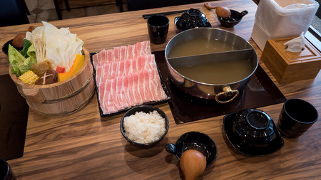 Taiwan food, sukiyaki, hotpot with pork and variety vegetable in the restaurantの写真素材