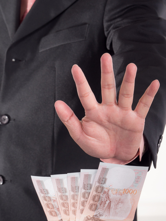 Businessman decline a bribe on isolated / white background. Stop corruption and fraud conceptsの写真素材