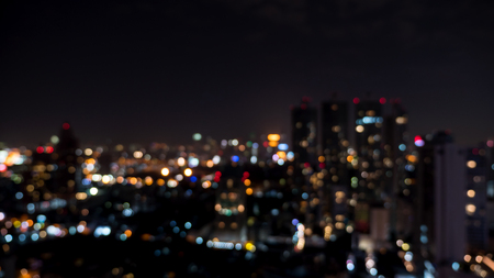 Cityscape night light bokeh, blur background at the street in Bangkok, Thailandの写真素材