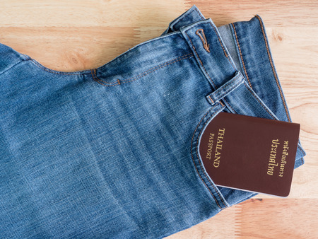 Closeup of Thailand passport in blue jean pocket with top viewの写真素材