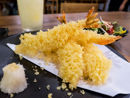 Closeup shrimps tempura deep fried on dish in the restaurant (Japanese food)の写真素材