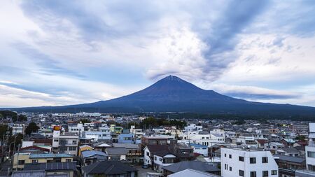 Mountain with cityscape over blue sky in the afternoon