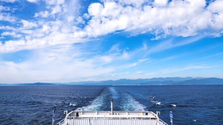 Back view and ship wake from the Suruga Bay Ferry cruise / boat at Shimizu port, Shizuoka, Japan (Water surface wave from back of ferry boat)のeditorial素材