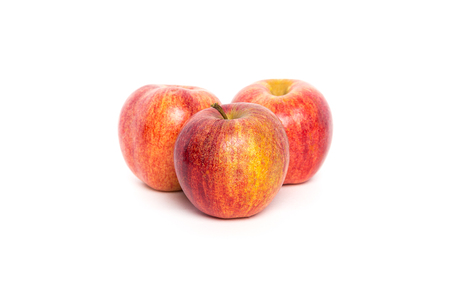 Three Red Apples on White Backgroundの写真素材