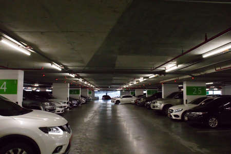 Coming, leaving. Smart parking guidance in department store with light overhead. Car lot : 13...