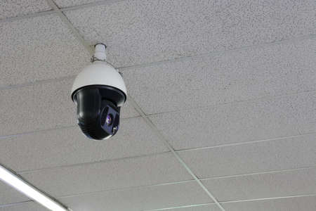 Security camera CCTV. Dome on top at airport ceiling.の写真素材