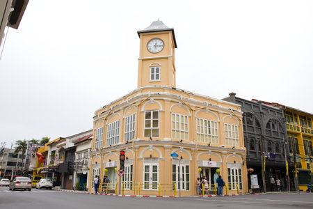 Yellow clock tower museum, landmark of Phuket city. Old town historical Chartered Bank building : 18 October 2020 - Phuket city, Thailand.のeditorial素材