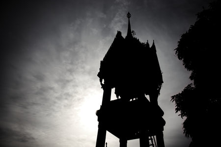 Pagoda temple bell tower. Silhouette, vignetting. With twilight sky before evening. Bell tower signal monk for daily activity.の写真素材