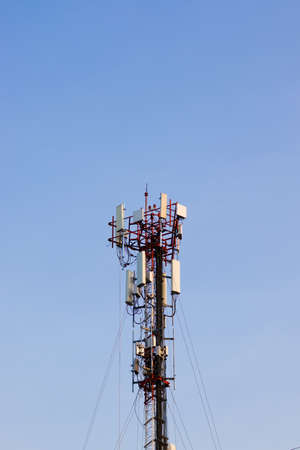 Telecommunication tower with blue sky background.