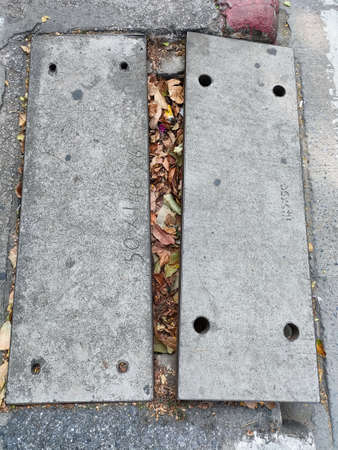 Broken sidewalk brick block in urban. Risk, danger for pedestrians. Concept city life.の写真素材