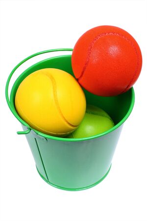Bucket full with colored ballsの写真素材