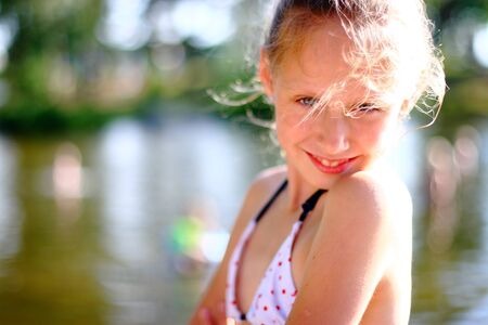 Smiling teenage girl enjoying nice summer dayの写真素材