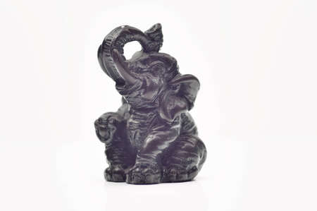 Elephant statuette of ebony closeup on white backgroundの写真素材