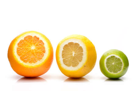 Lime, lemon and orange close up on a white backgroundの写真素材