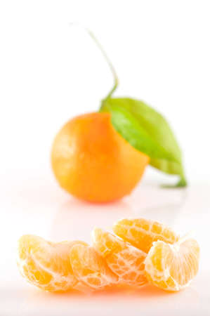 Tangerine slices on a white background close-upの写真素材
