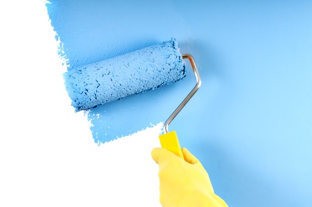 blue color painting wall with roller