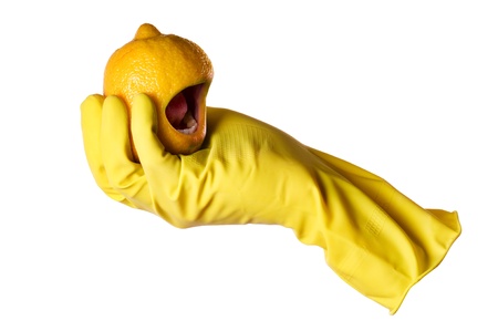 yellow rubber glove and lemon with mouth の写真素材