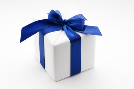 white gift box with blue ribbonの写真素材