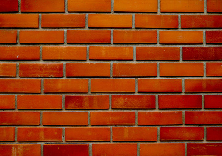 orange-brown brick wall pattern background. rough solid texture and grunge surface. Can be use for...