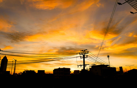 Beautiful landscape silhouettes of city. Bright orange sunset sky background.