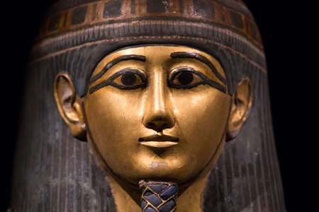 Leiden, The Netherlands - JAN 04, 2020: closeup of an old sarcophagus from ancient Egypt. Pharaoh golden face.のeditorial素材