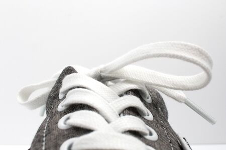Closeup of a sneaker shoe from the front with a white background. Shoes.の写真素材