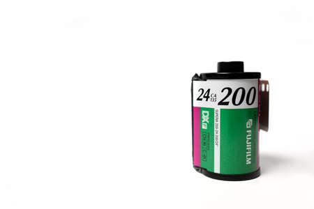Schiedam, The Netherlands - DEC 29, 2019: Closeup of an old Fujifilm 35mm color film roll on a white...
