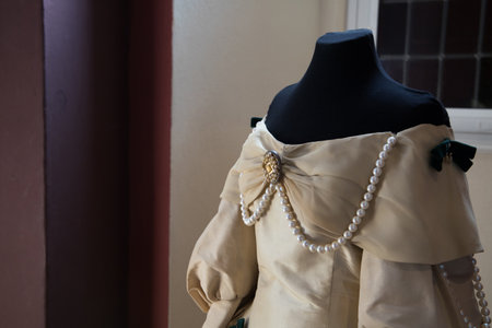 Hoensbroek, The Netherlands - SEPT 09, 2021: closeup of an original old dress with jewelry in castle Hoensbroek.のeditorial素材