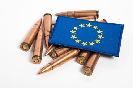 EU flag with weapon ammunition. EU delivery of weapons and ammo to Ukraine. Military assistance...