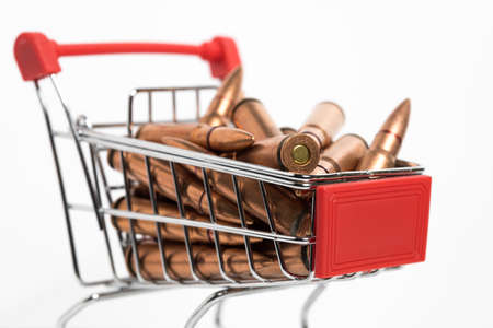 Closeup of a small shopping cart with ammunition inside. 7.62x39 rifle bullets.