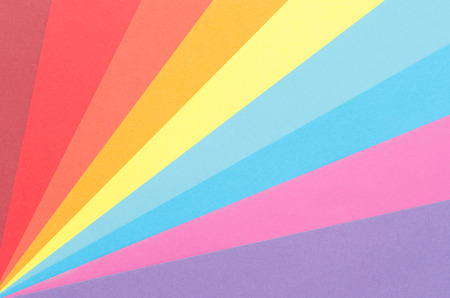 colorful construction paper arranged as diagonal rays の写真素材