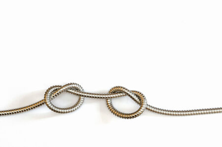 two knots in a flexible metal hose